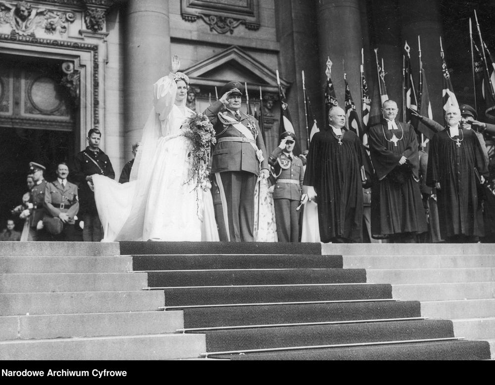 Hermann and Emmy Göring leave the Berlin cathedral after their wedding, followed by their witness Adolf Hitler